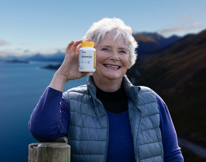 Woman holding Lester's Oil Advanced in Queenstown