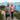 Elderly couple using grip strength trainer whilst hiking in New Zealand
