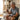 Elderly man sitting on couch using grip strength trainer
