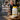 Lester's Oil Omega-3 supplement bottle with a couple in the background