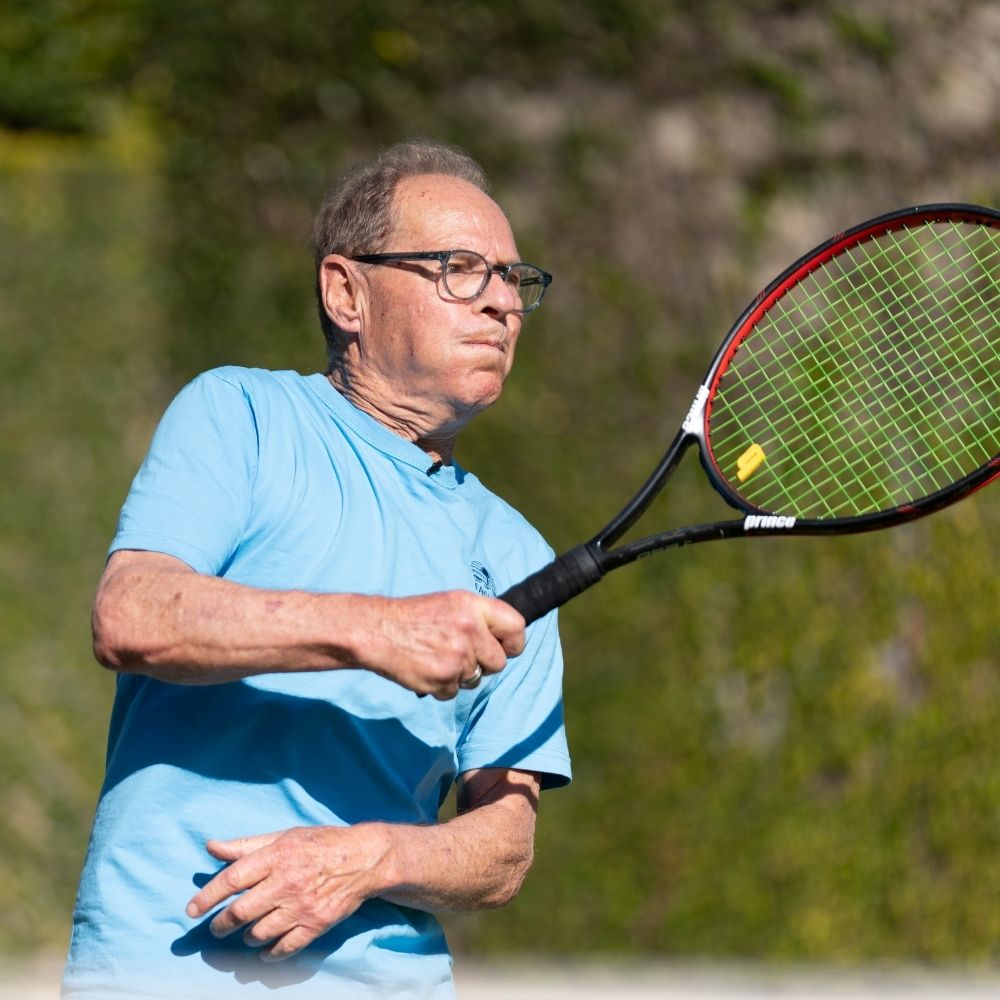 Tony Falkenstein playing tennis. 