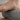 Close up of grey foot massage roller under the foot