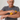 Man rolling the compact massage roller on his forearm