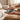 Hands holding blue massage roller 