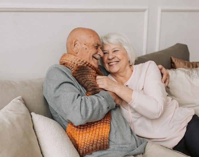 Elderly couple laughing 