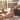 Massage roller being used on leg for stiff muscles