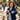 Woman walking her dog in a city park, wearing the Wrist Band with Zip Pocket.