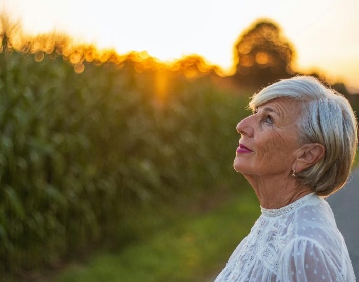 Woman feeling relaxed in nature after using lester's night cap